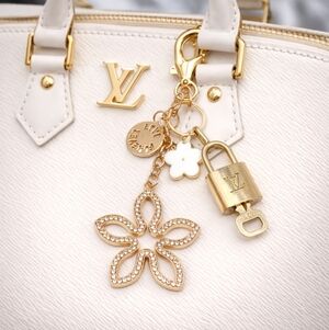 Authentic Louis Vuitton Lock & Key with Unbranded Flower Clover Charm, Keychain